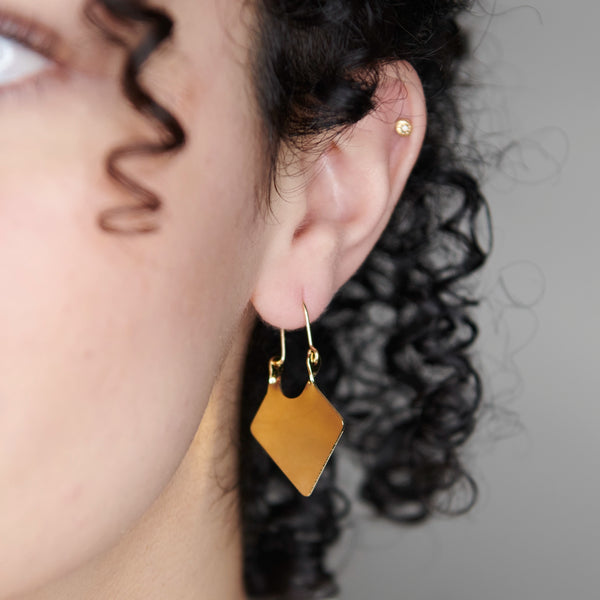 A Woman Wearing Chana Hoop Earrings