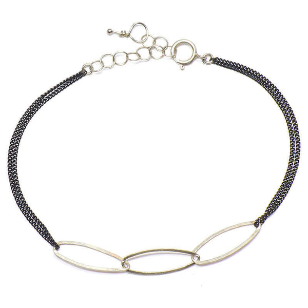 Black oxidized chain bracelet with silver oval links at center.