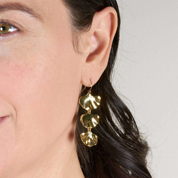 A Woman Wearing Angela Leaf Earrings