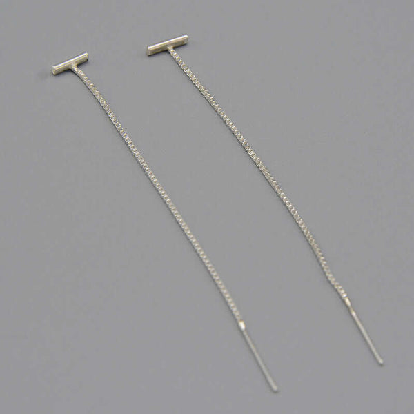 Pair of silver threader earrings, small bar with fine gold chain ending in bar.
