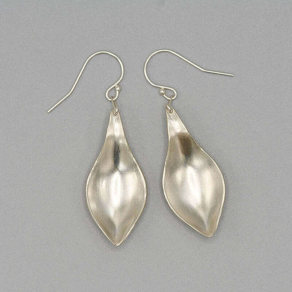 Pair of silver earrings, with curved simple leaf design, shown askew.
