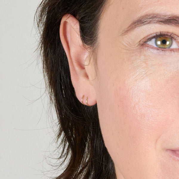 A Woman Wearing Curl Twist Earrings