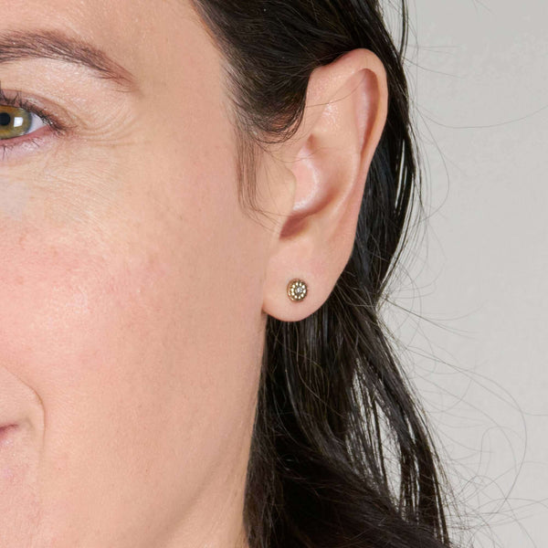 A Woman Wearing Daisy Large Flower Post Earring on Pierced Ear