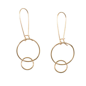 Pair of gold earrings with large and small interlocked circles on long earwire.