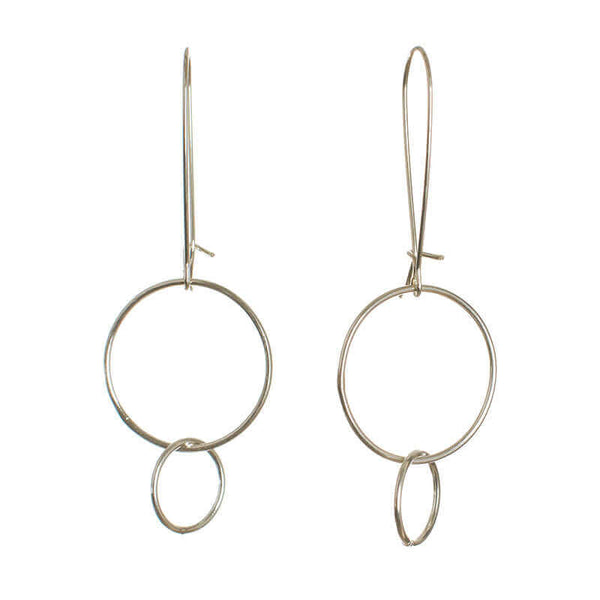 Pair of silver earrings with large and small interlocked circles on long earwire.