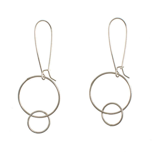 Pair of silver earrings with large and small interlocked circles on long earwire.