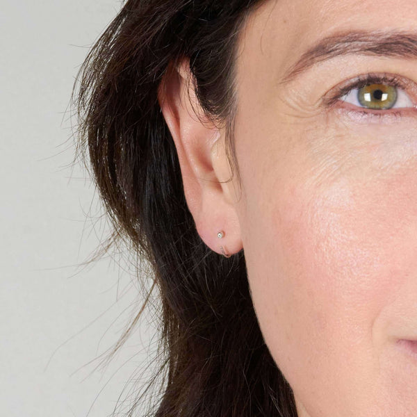A Woman Wearing Elin Silver Earrings