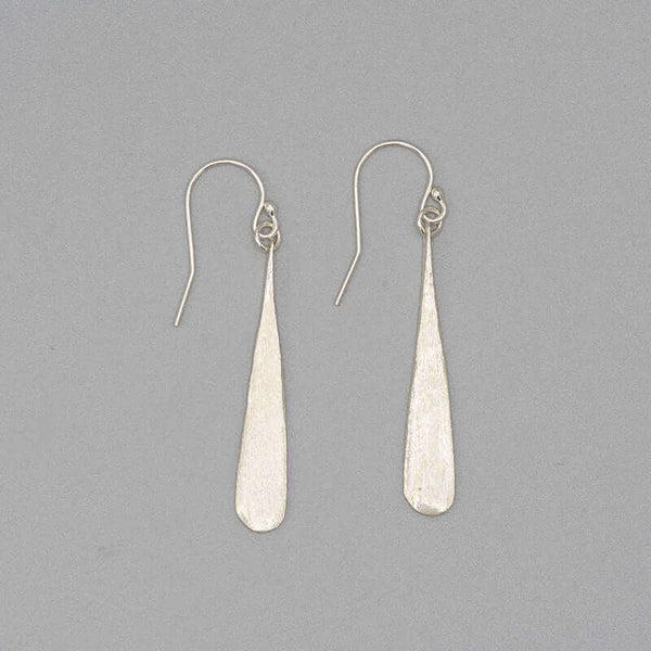 Pair of silver earrings shaped like elongated teardrop.