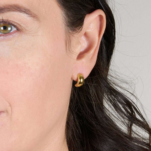 A Woman Wearing Gaby Semi Hoop Earrings