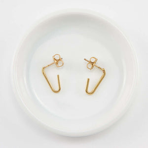 Pair of gold bent angle earrings on posts.