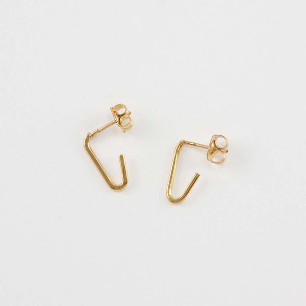 Pair of gold bent angle earrings on posts.