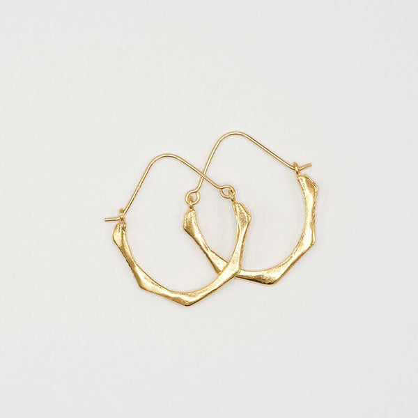 Pair of cast brushed gold hoop style earrings.