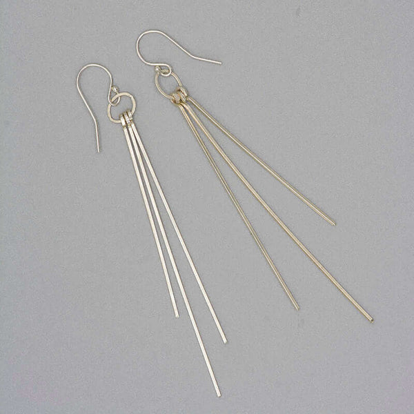 Pair of silver dangle earrings with three varied length square wires.
