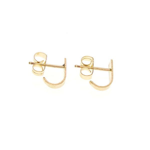 Pair of tiny gold post cuff earrings that wrap around earlobe.