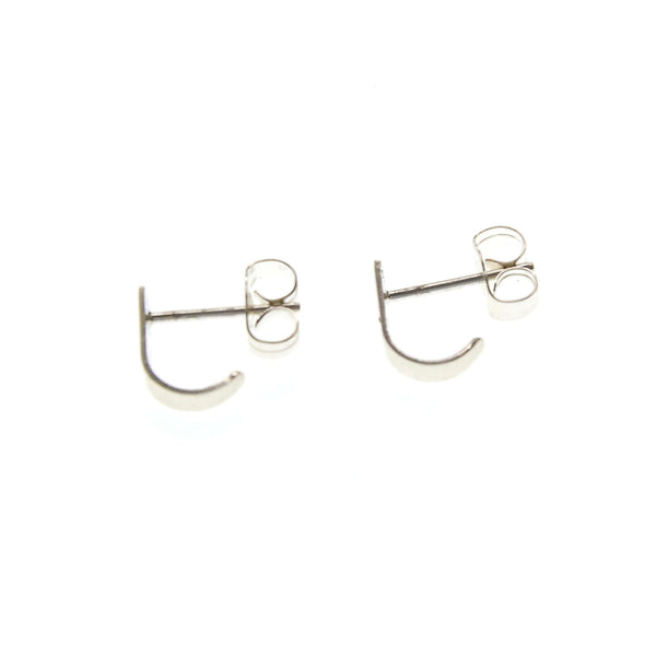 Pair of tiny silver post cuff earrings that wrap around earlobe.