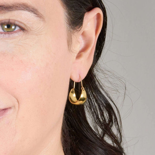 A Woman Wearing Phoebe Hoop Earrings