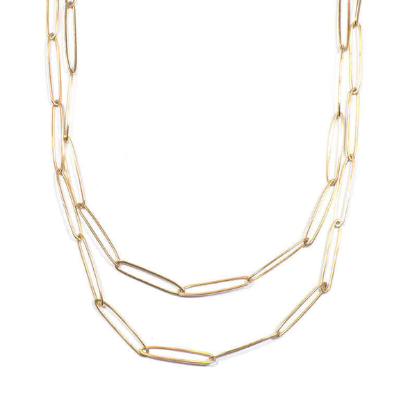 Gold elongated link necklace with clean modern design shown doubled up.