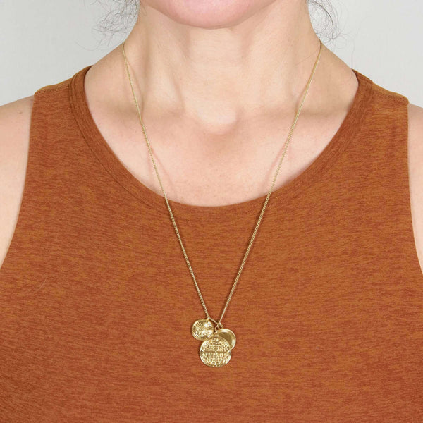 A Woman Wearing a Colleen Coins Pendant Necklace