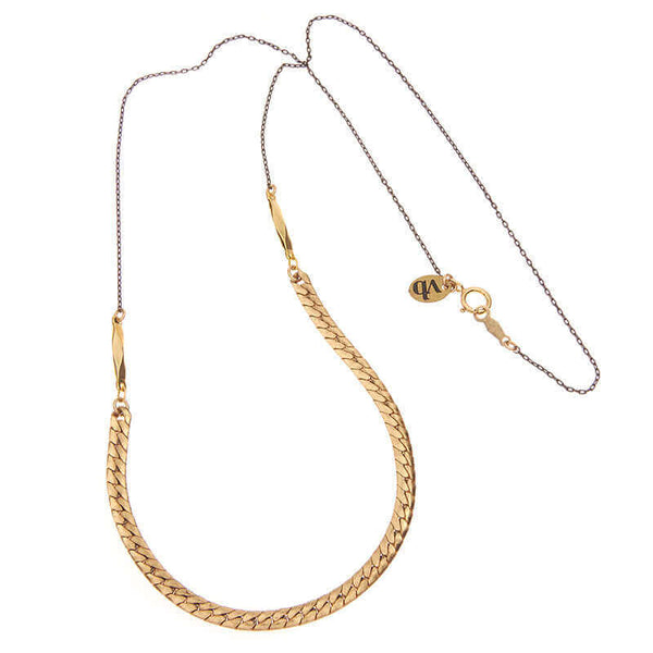 Necklace with black chain on top and flat brass curb chain in front, shown full length.