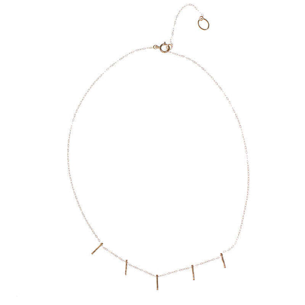 Delicate gold chain necklace with 5 small vertical bar accents on bottom.
