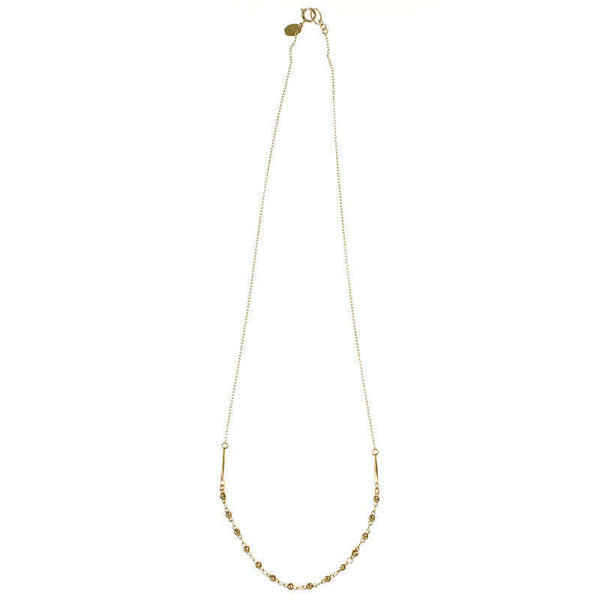 Delicate gold chain necklace with bead chain detail at bottom.