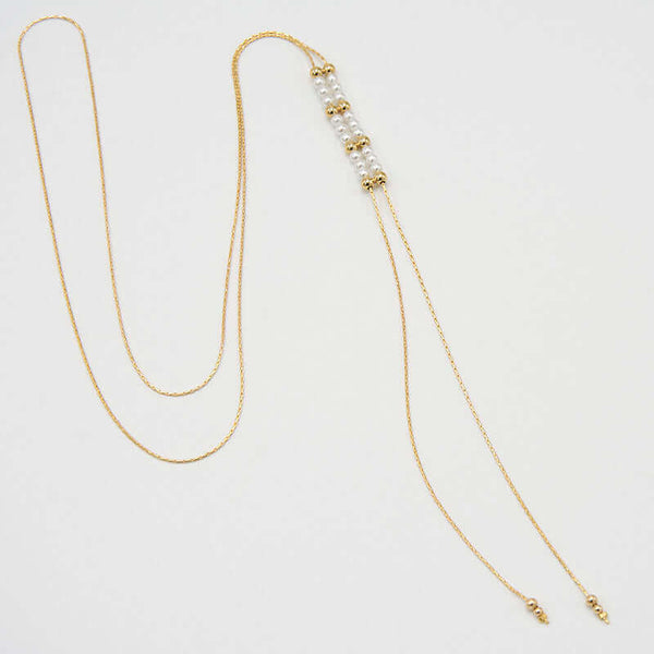 Gold chain necklace with pendant of double rows of white pearls and gold beads, that slide to adjust length.