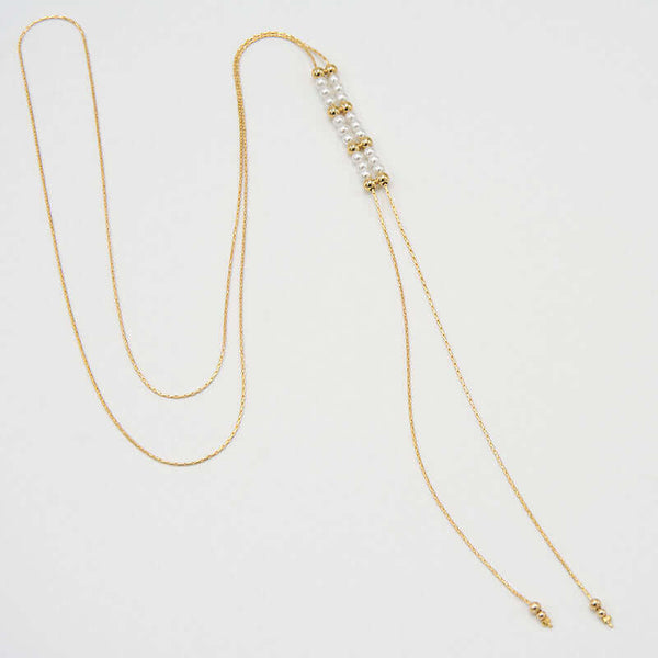 Gold chain necklace with pendant of double rows of white pearls and gold beads, that slide to adjust length.