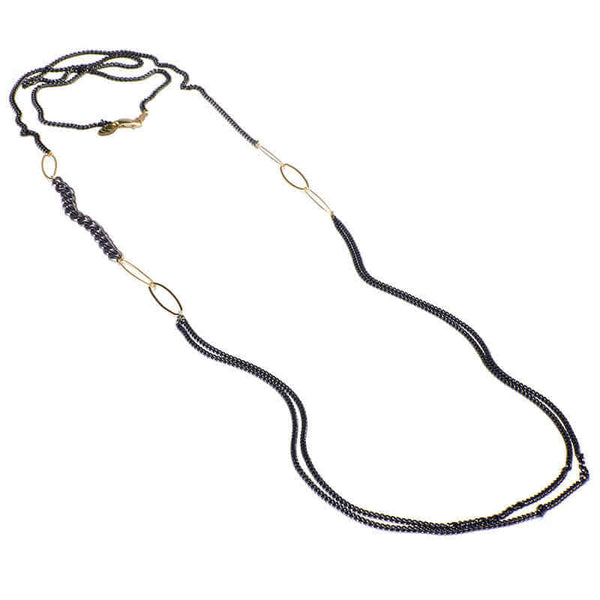 Long black oxidized silver multi-chain necklace with gold link details along chain.