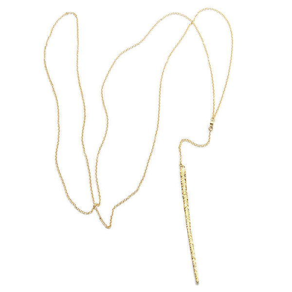 Delicate long gold necklace with elongated thin feather pendant.