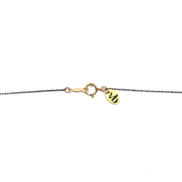 Close-up of black oxidized chain necklace showing clasp detail.