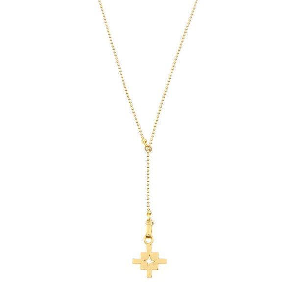 Close-up of gold bead chain necklace with small geometric cross shaped pendant and slider.