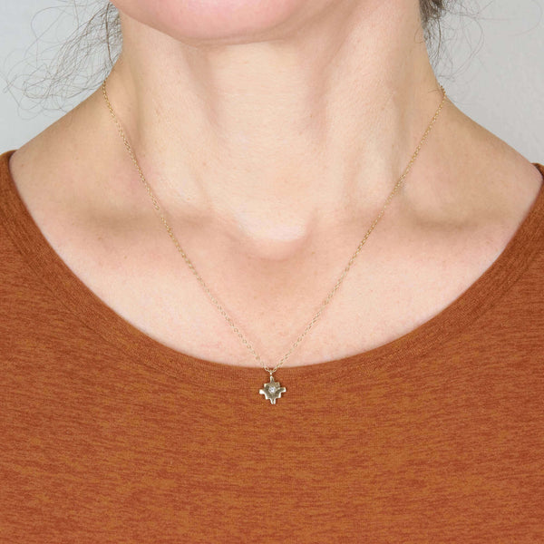 A Woman Wearing Salma Cross Star Pendant Necklace