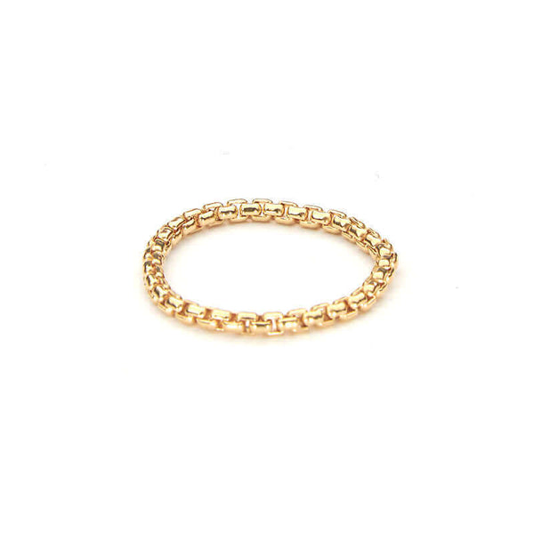 Close-up of gold chain ring.