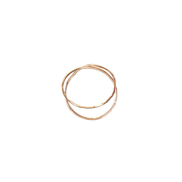 Gold ring with two loops of wire crossing.