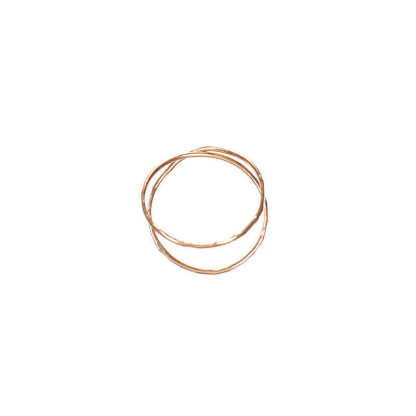 Gold ring with two loops of wire crossing.