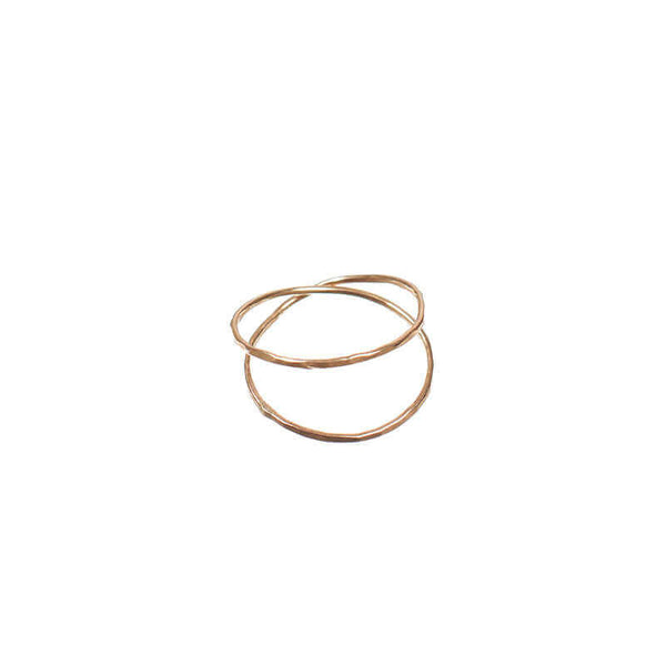 Gold ring with two loops of wire crossing.