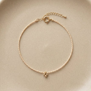 RHODAS FLOWER BRAIDED STRING BRACELET