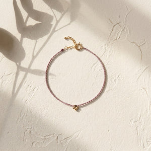 RHODAS FLOWER BRAIDED STRING BRACELET