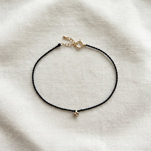 RHODAS FLOWER BRAIDED STRING BRACELET