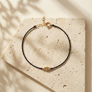 RHODAS BUBBLES BRAIDED STRING BRACELET