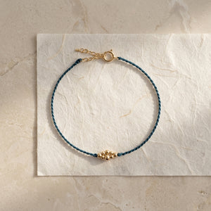 RHODAS BUBBLES BRAIDED STRING BRACELET