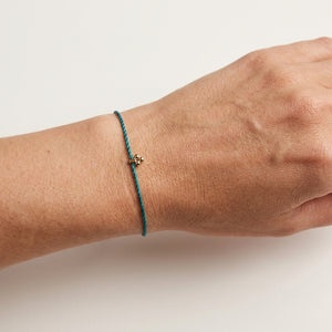 RHODAS FLOWER BRAIDED STRING BRACELET