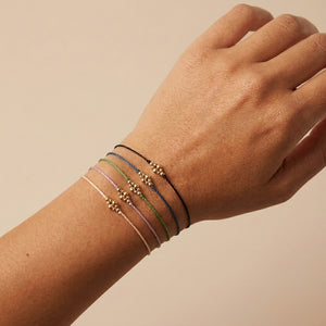 RHODAS BUBBLES BRAIDED STRING BRACELET