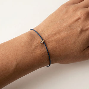 RHODAS FLOWER BRAIDED STRING BRACELET