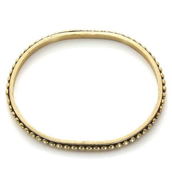 Polished brass beaded bangle bracelet, shown from above.