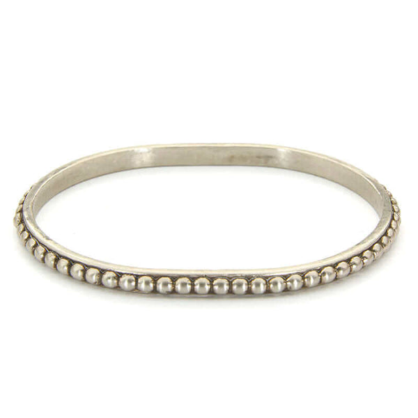 Polished white bronze beaded bangle bracelet.