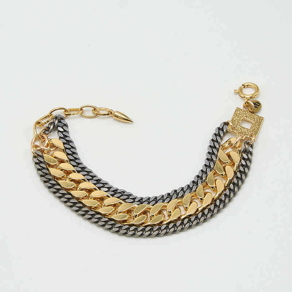 Multi-chain bracelet of chunky dark and gold chain with square and oval link at clasp.