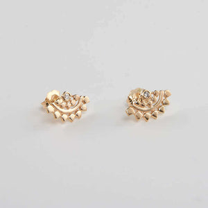 Pair of fan-shaped gold earrings with lace pattern, inset with small diamond.