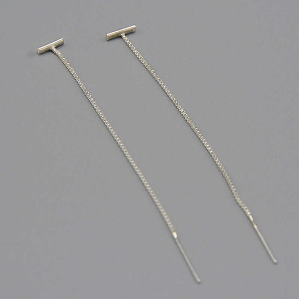 Pair of silver threader earrings, small bar with fine gold chain ending in bar.