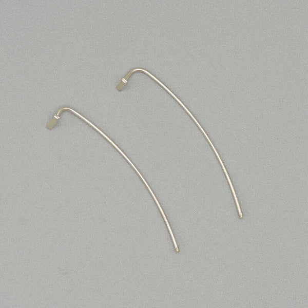 Pair of silver bar threader earrings with wire bar extending down.